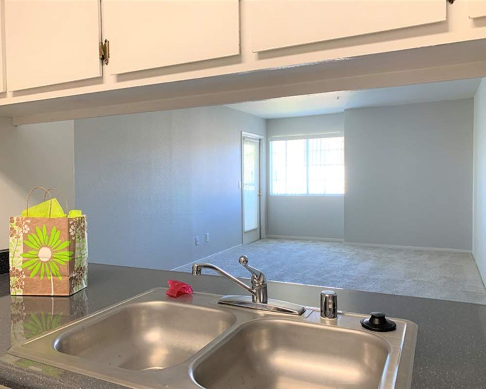 Drop In double kitchen sink, and granite countertops at Somerset Senior Apartments in Antioch, California