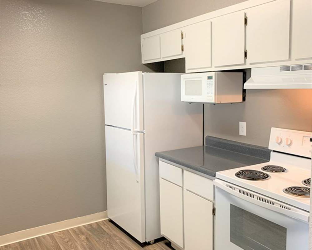 Fully-equipped kitchen with appliances and island at Somerset Senior Apartments in Antioch, California