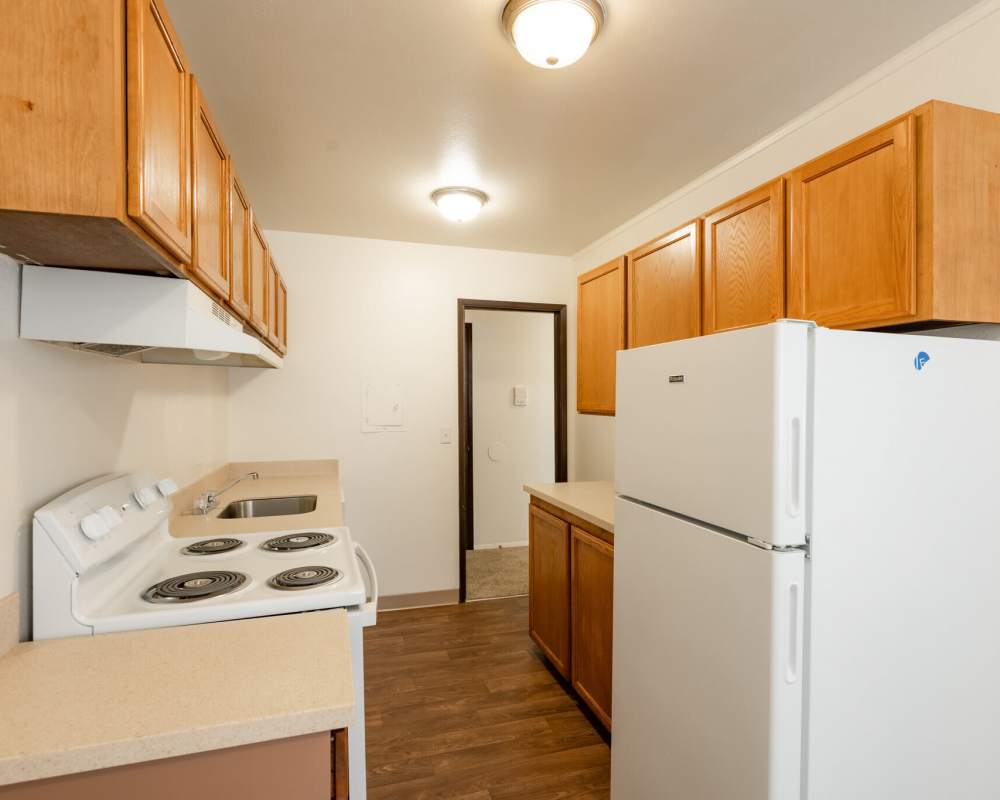 Modern Kitchen with refrigerator at Park Hill Apartments in Seattle, Washington