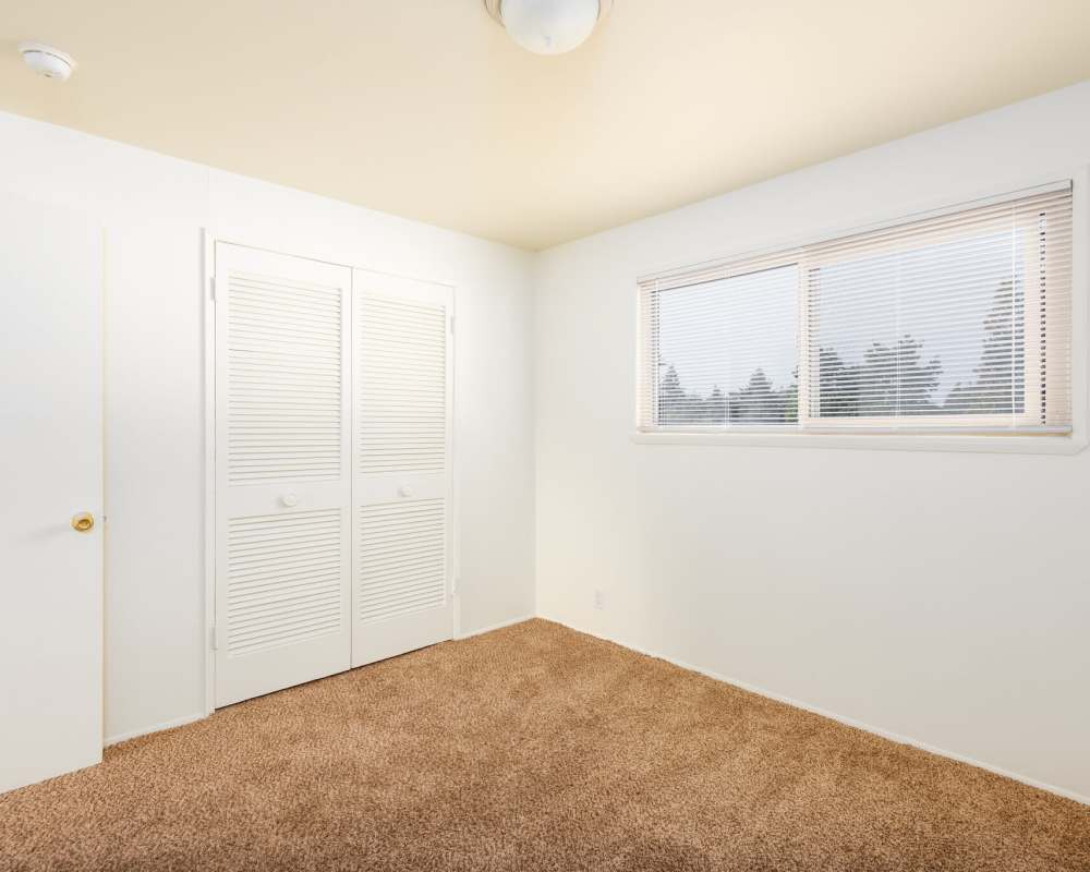 Modern Bedroom with wardrobe at Park Hill Apartments in Seattle, Washington