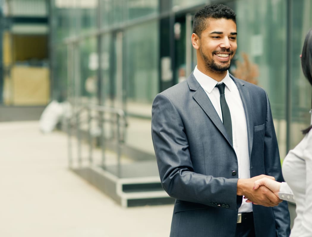 Man leaving interview at JMG Realty in Atlanta, GA