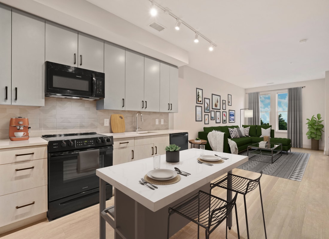 Sleek kitchen with white countertops and black appliances at Big Sky Flats in Washington, District of Columbia