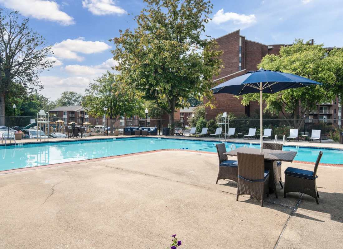 Swimming pool with table at Columbia Pointe in Columbia, Maryland