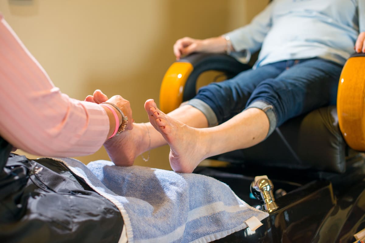 A woman getting toe nails done at Watercrest at Mansfield in Mansfield, Texas