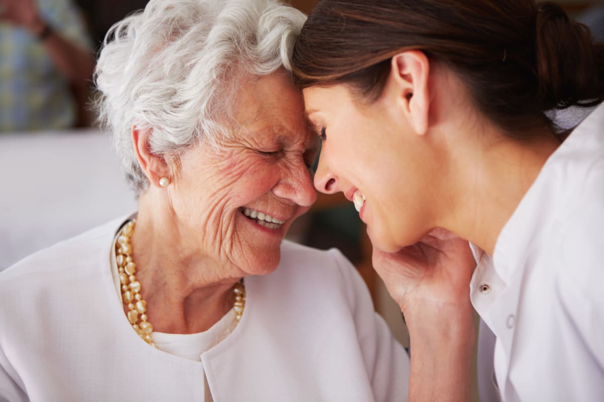 Resident being helped by a volunteer at Prestonwood Court in Plano, Texas