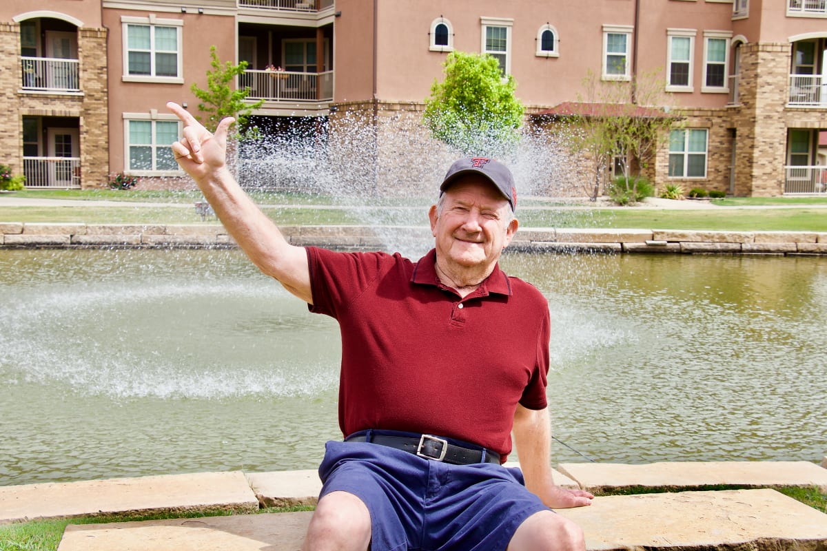 Resident by the fountain at Raider Ranch in Lubbock, Texas