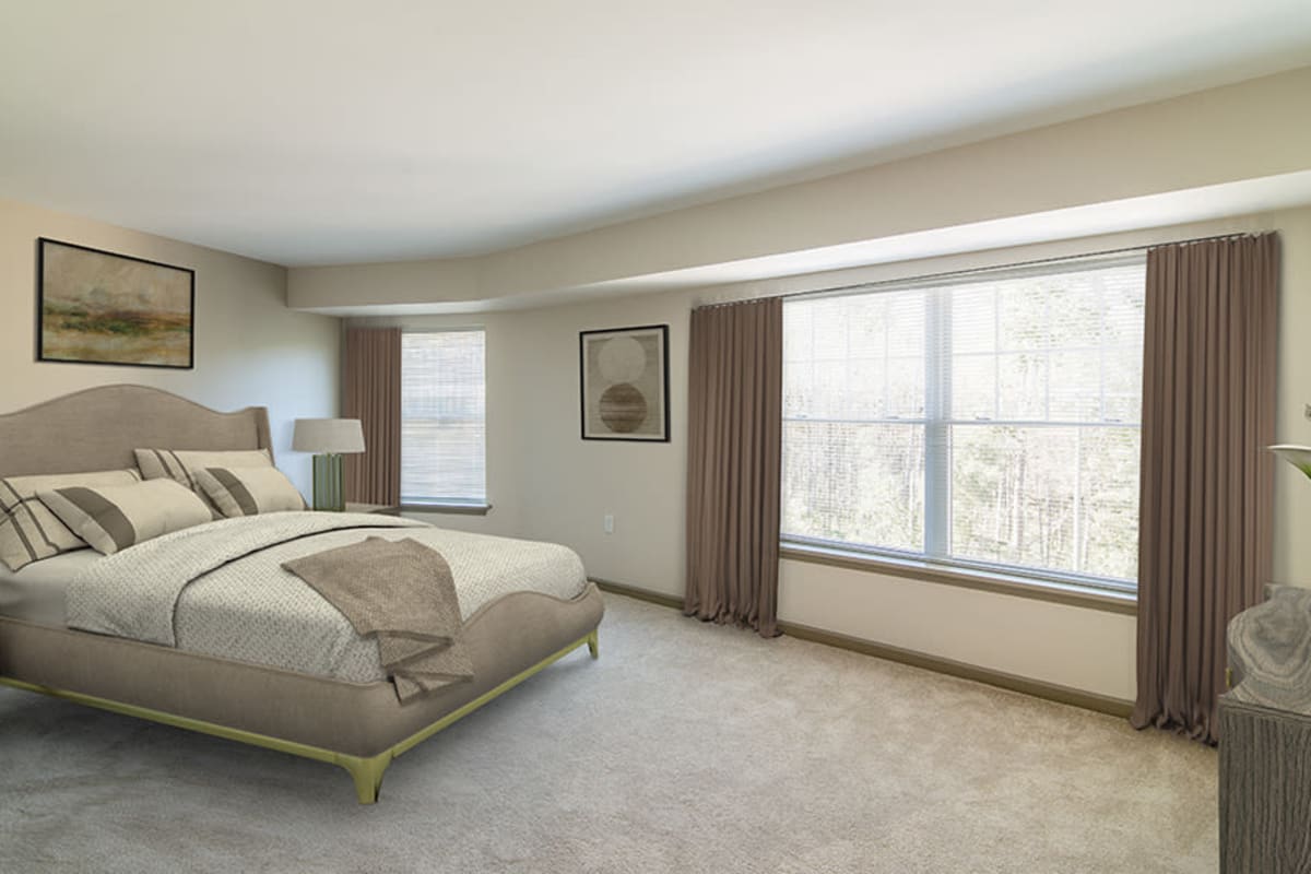 Comfortable bedroom at Greenwood Cove Apartments home in Rochester, New York