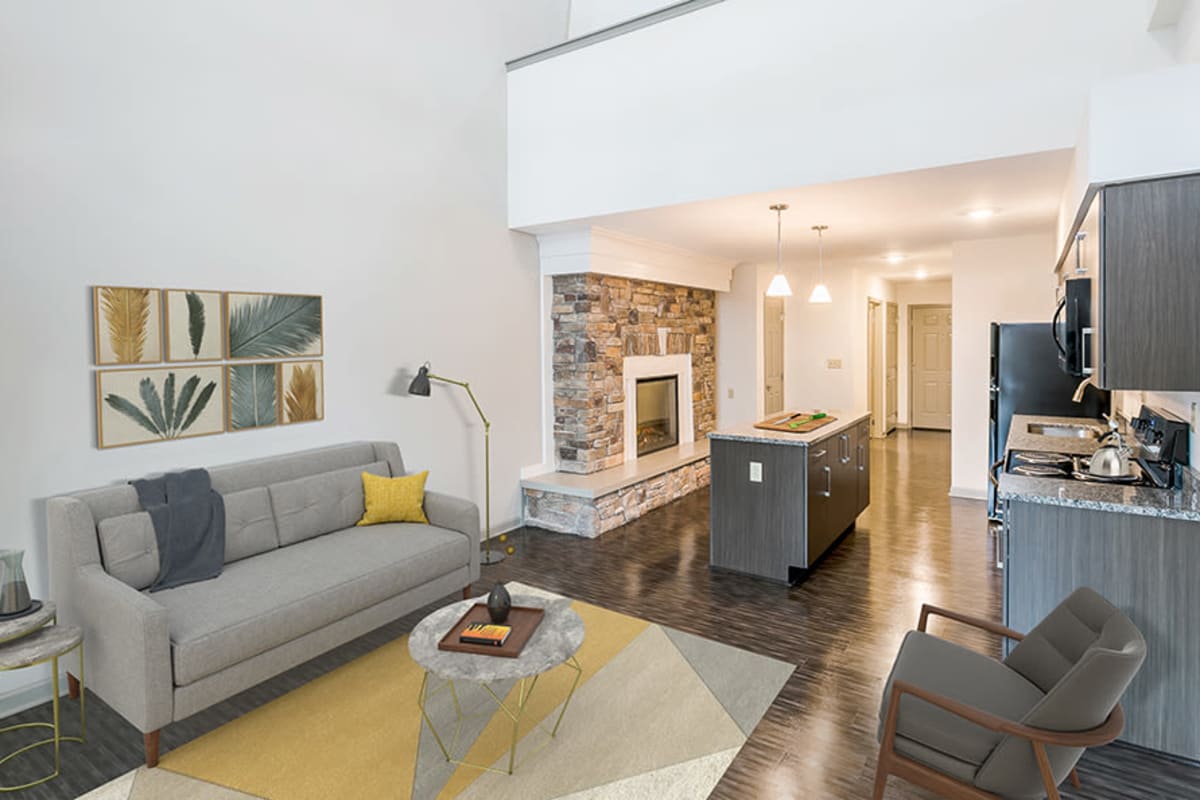 Living room with patio access at Greenwood Cove Apartments in Rochester, New York