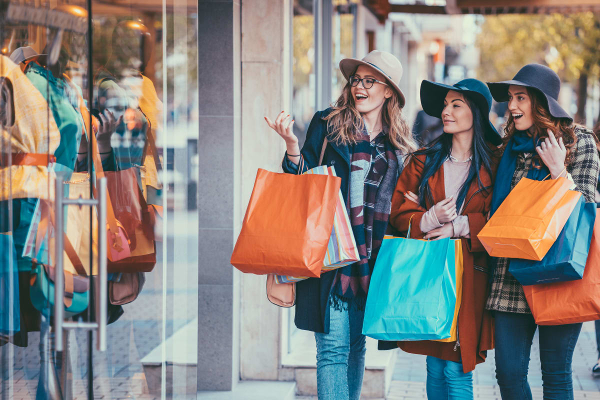 Women on a shopping spree near Brighton Place in Midvale, Utah