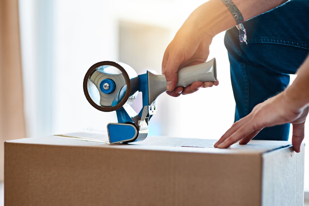 Preparing items to be loaded into a moving truck and stored at Devon Self Storage in Fort Worth, Texas