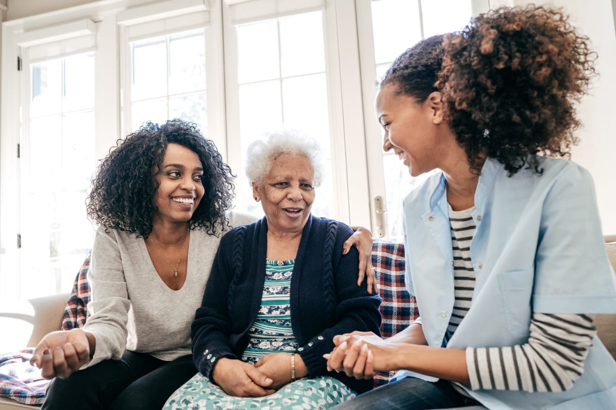 Residents and family members enjoying spending time together at Meridian Senior Living