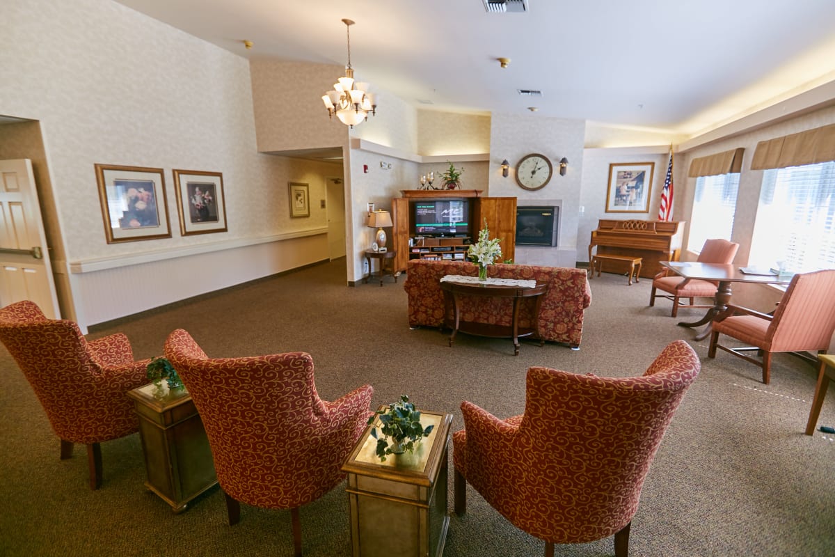 Lounge area with a tv and a piano at Ashley Pointe in Lake Stevens, Washington