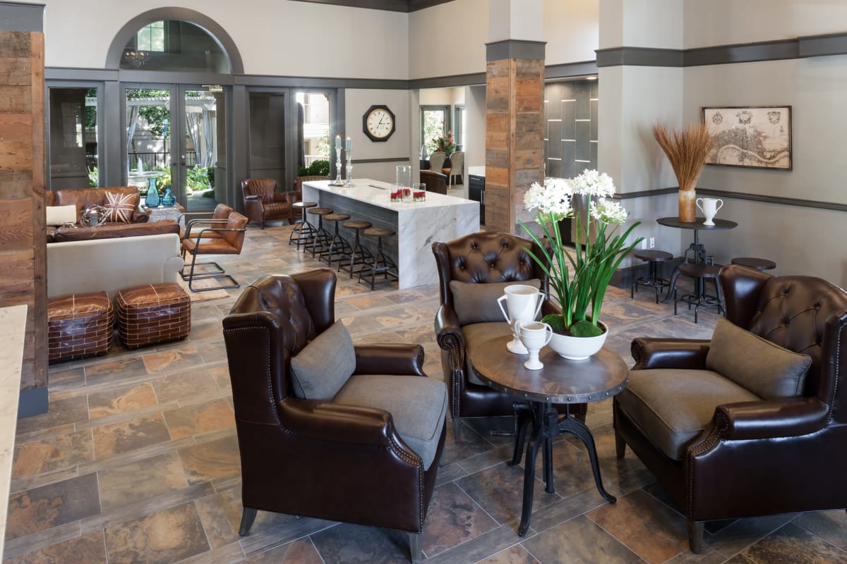 Warm and welcoming lobby with lounge areas at Hyde Park at Montfort in Dallas, Texas
