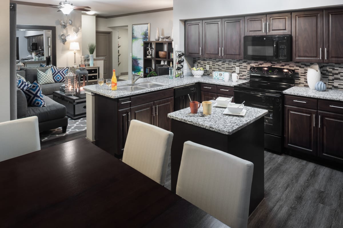 Spacious and well-furnished open-concept floor plan in a model home at Tintara at Canyon Creek in Austin, Texas