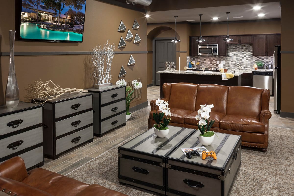 Lounge area with a flatscreen TV in the clubhouse at Tintara at Canyon Creek in Austin, Texas