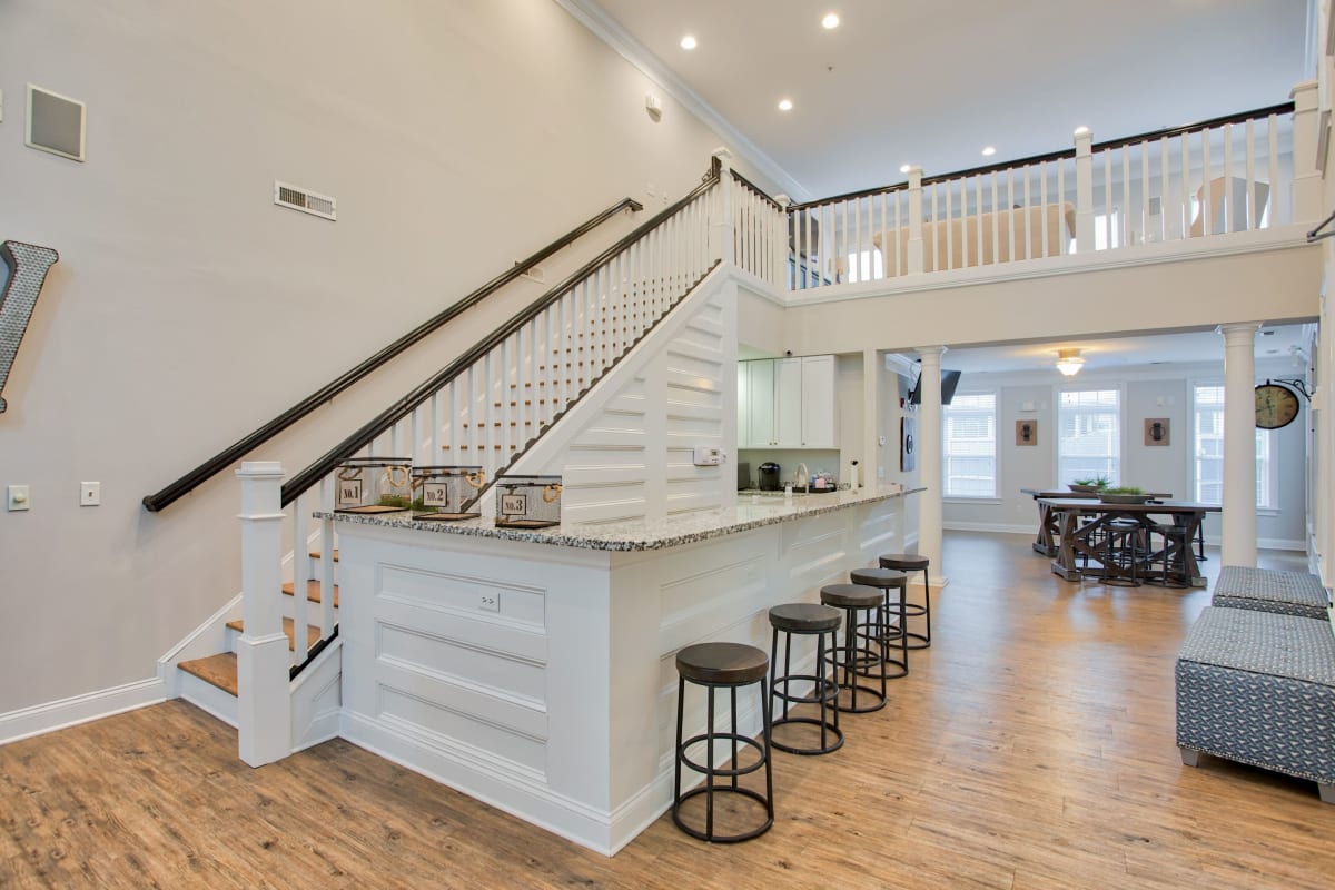 Large bar in clubhouse with plenty of seats at Worthington Apartments & Townhomes in Charlotte, North Carolina