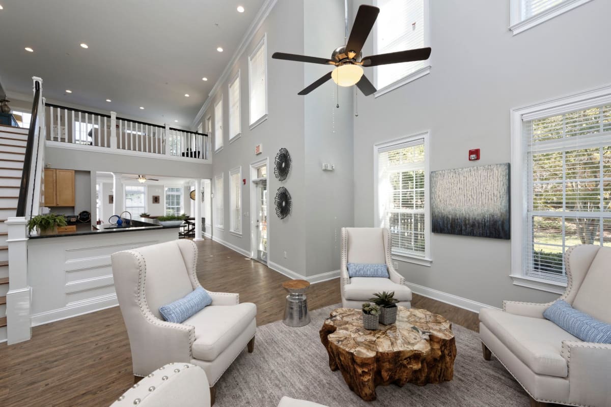 Hang out at the clubhouse with large ceiling fans at Worthington Apartments & Townhomes in Charlotte, North Carolina