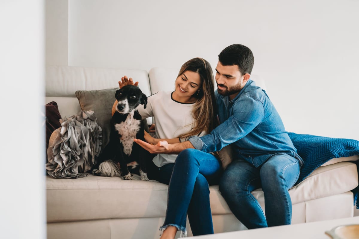 Residents petting their dog at The District Flats in West Palm Beach, Florida
