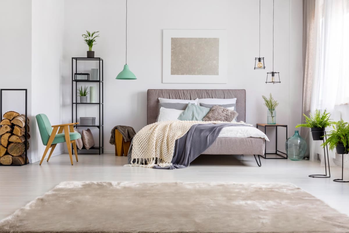 Cozy bedroom at The District Flats in West Palm Beach, Florida