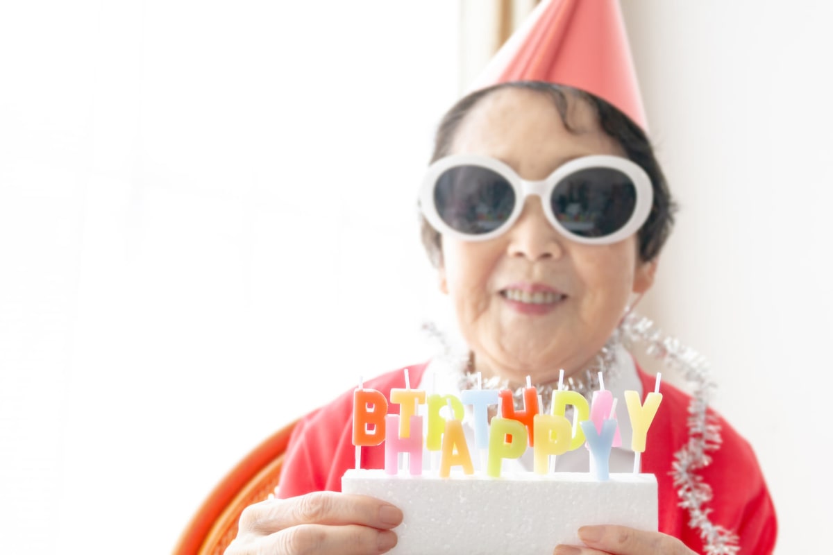 Resident celebrating a birthday at Glen Carr House Memory Care in Derby, Kansas