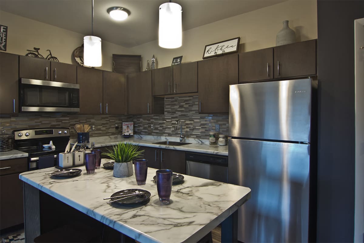 Modern kitchen with granite countertops at Park West 205 Apartment Homes in Pittsburgh, Pennsylvania
