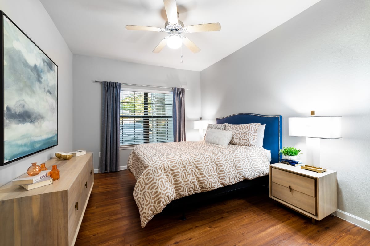 Bedroom with wood style flooring at Marquis Parkside in Austin, Texas