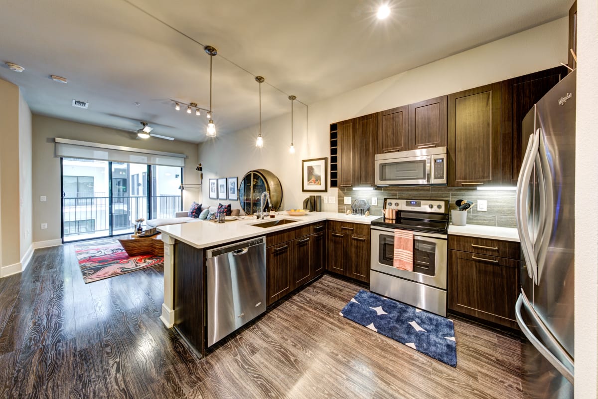 Kitchen with stainless steel appliances at Water Marq in Austin, Texas