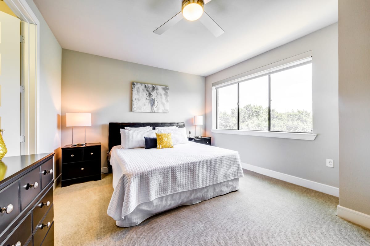 Bedroom with large windows at Water Marq in Austin, Texas
