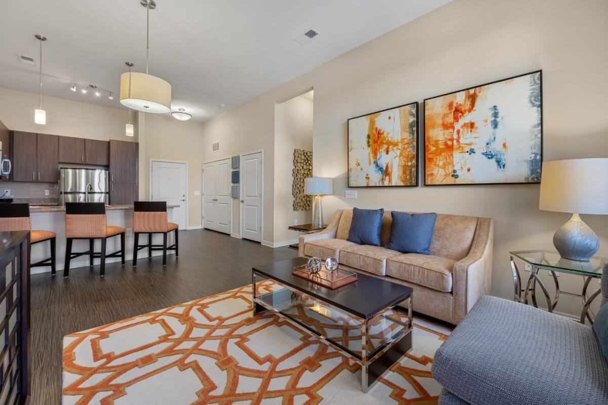 Modern and bright open living room and kitchen at Marq at Crabtree in Raleigh, North Carolina