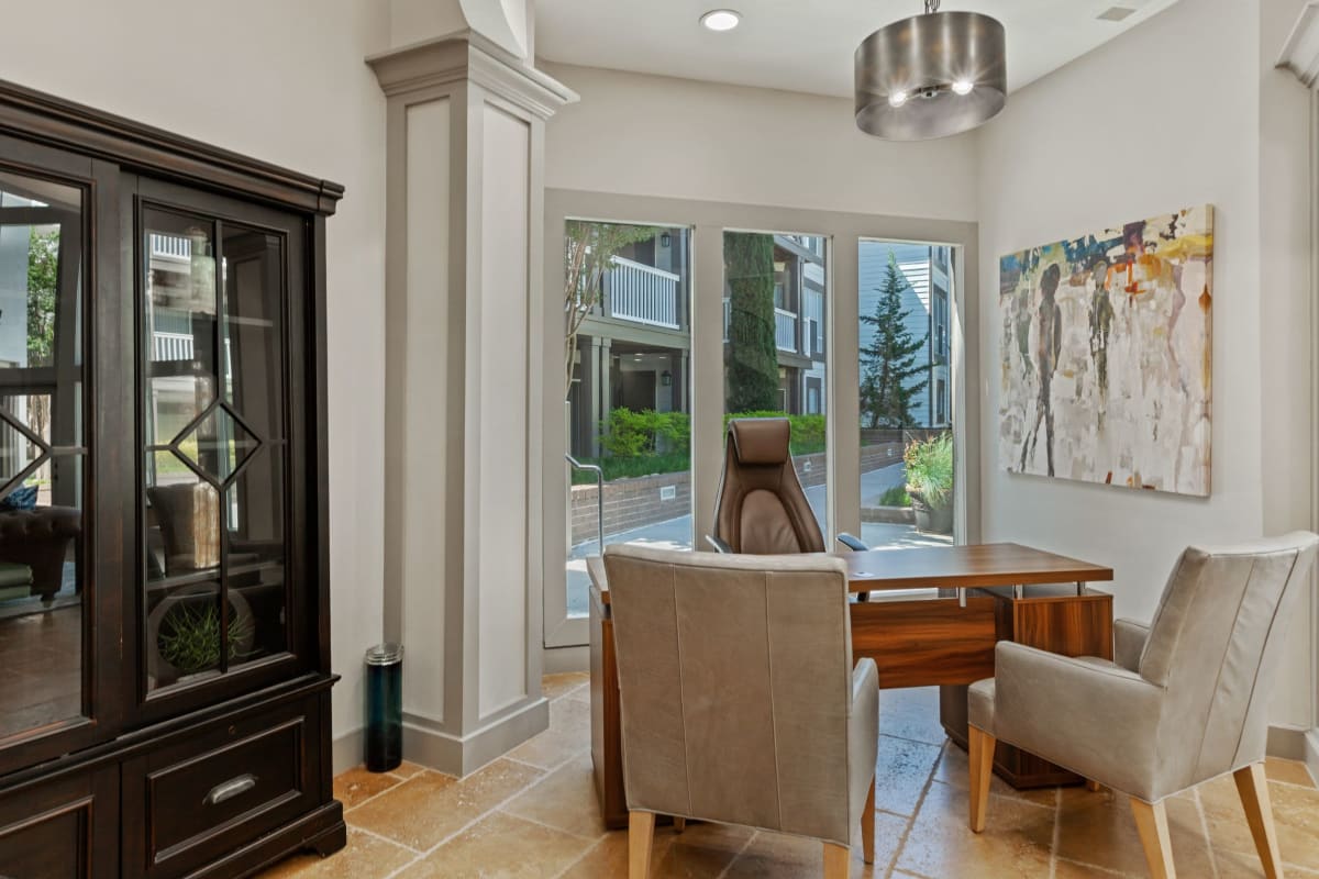 Nice dining area with a view to the patio at 45Eighty Dunwoody Apartment Homes in Dunwoody, Georgia