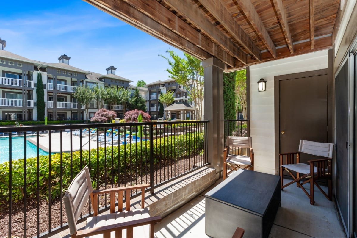 Awesome private patio with a view of the pool at 45Eighty Dunwoody Apartment Homes in Dunwoody, Georgia