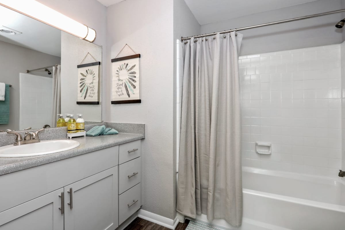 Large bathroom with bath and shower combined at 45Eighty Dunwoody Apartment Homes in Dunwoody, Georgia