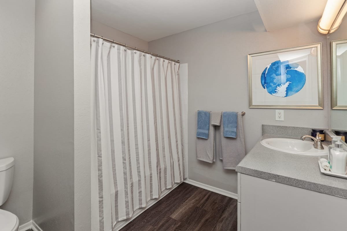 Nice wood flooring in the bathroom at 45Eighty Dunwoody Apartment Homes in Dunwoody, Georgia