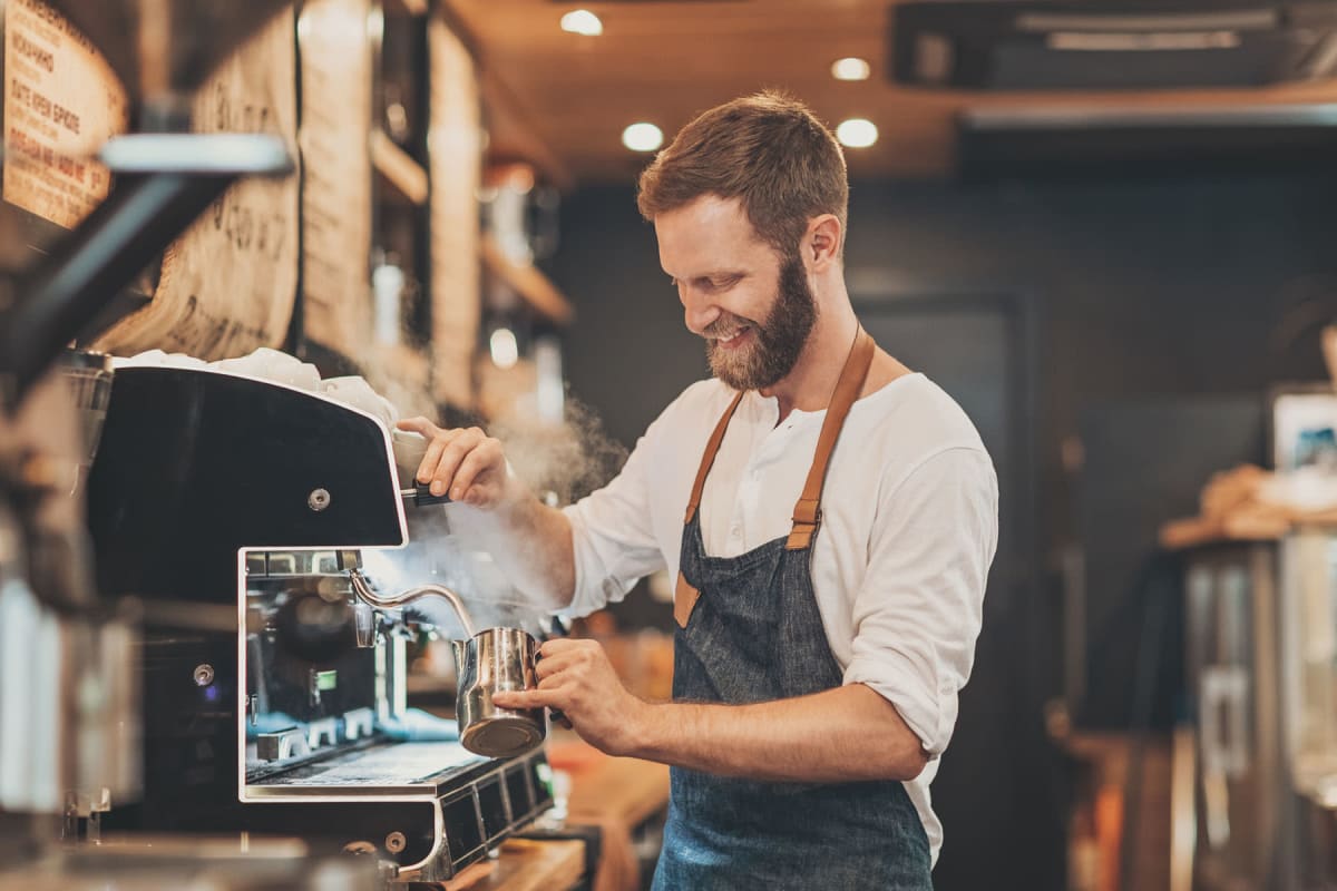 Resident out working at a coffee shop near Enchanted Springs Apartments in Colorado Springs, Colorado
