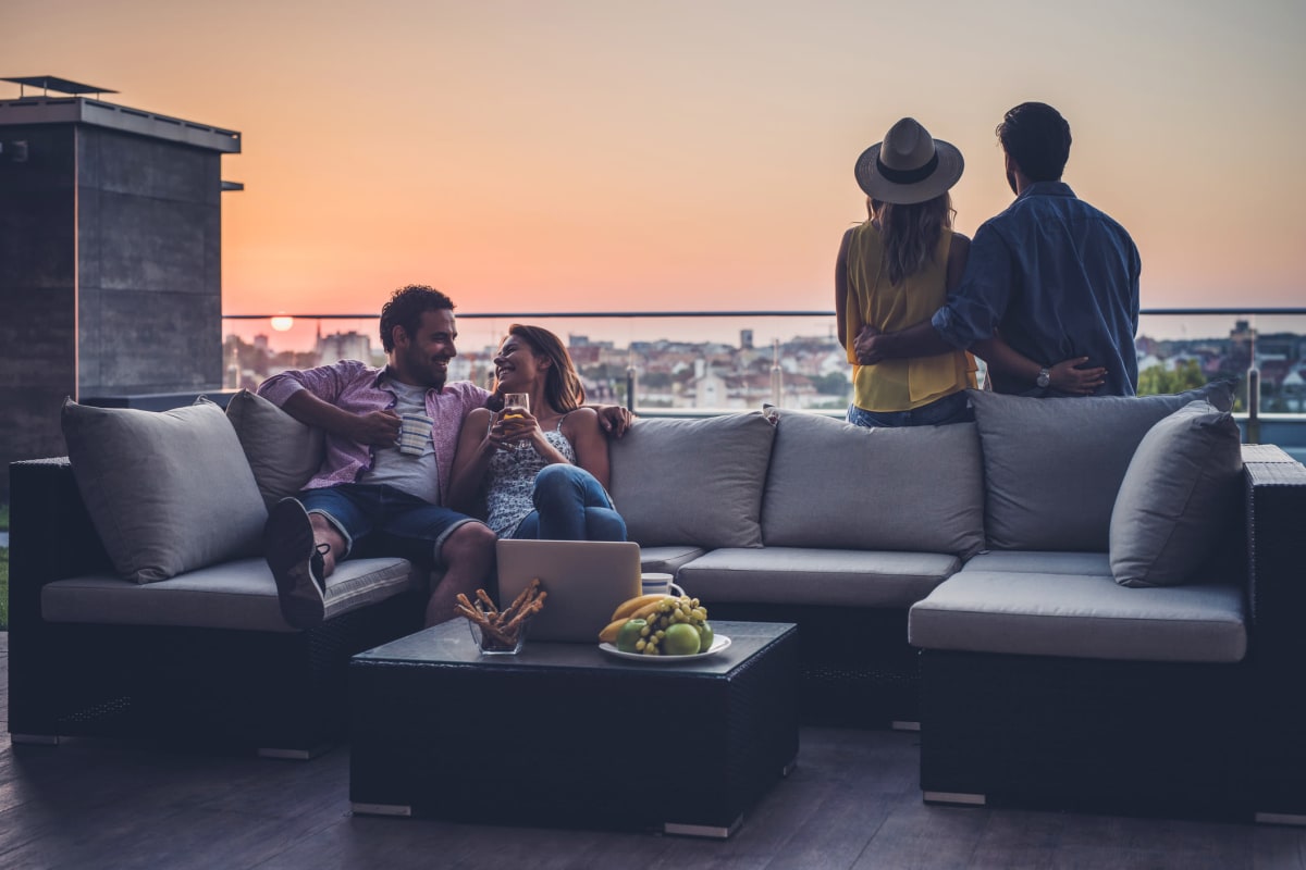 Residents enjoying a rooftop lounge at Enchanted Springs Apartments in Colorado Springs, Colorado