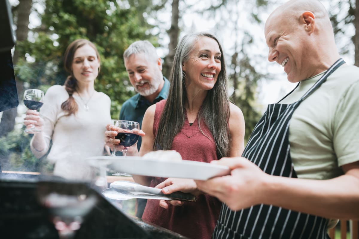 Residents gathered outside for a neighborhood barbecue at The Pointe at Siena Ridge in Davenport, Florida