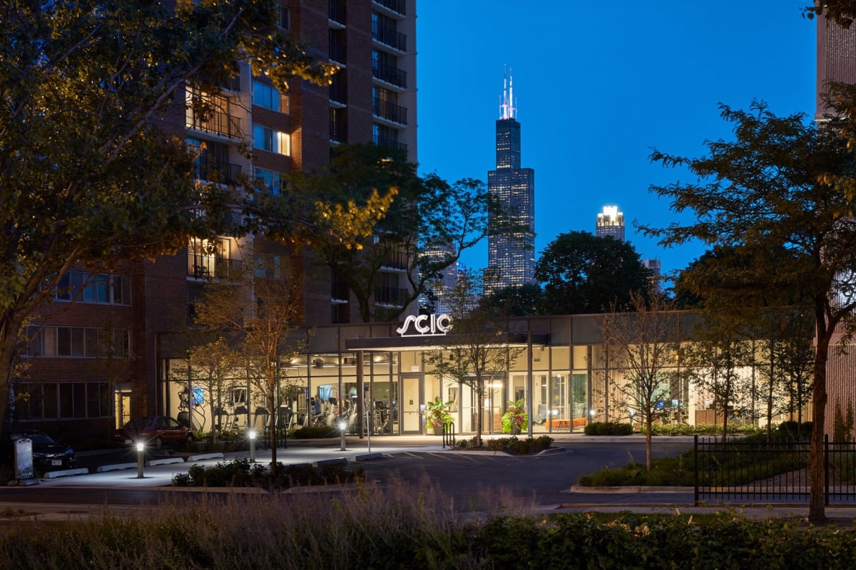Exterior shot of the building at night at Scio at the Medical District in Chicago, Illinois