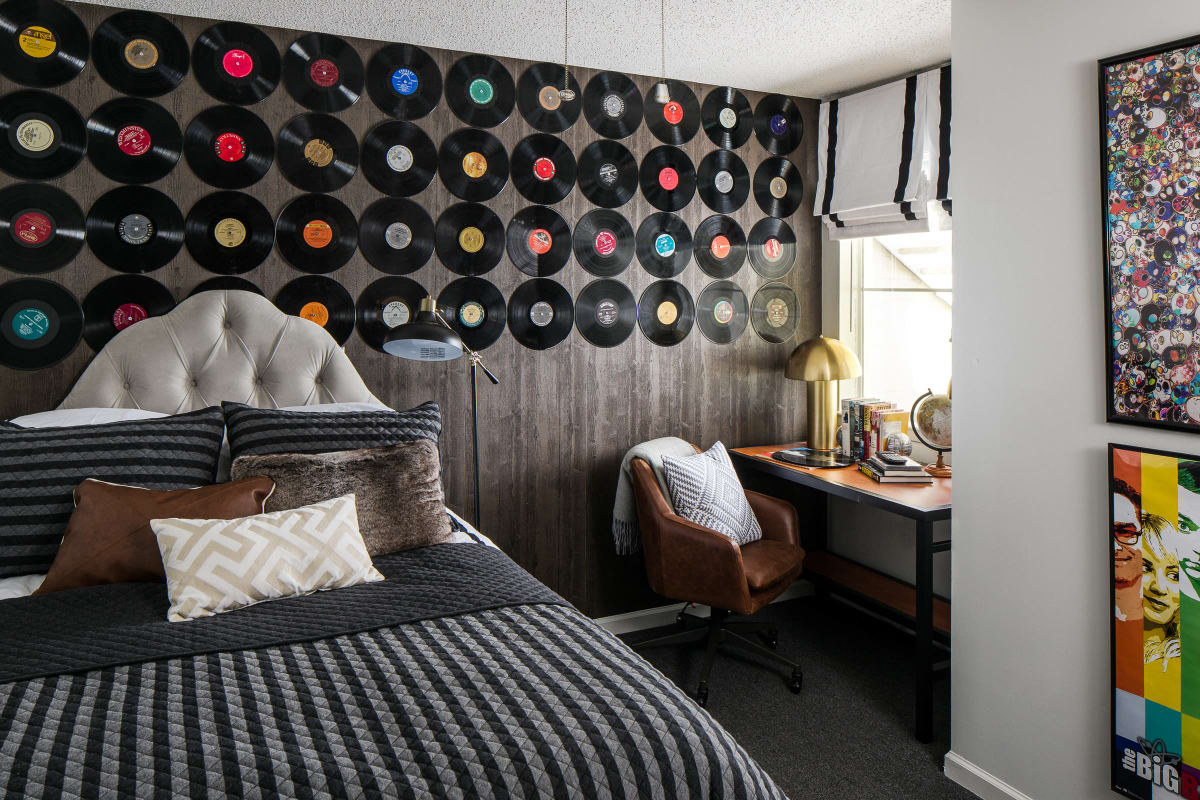Model student bedroom with eclectic decor at The Gramercy in Manhattan, Kansas