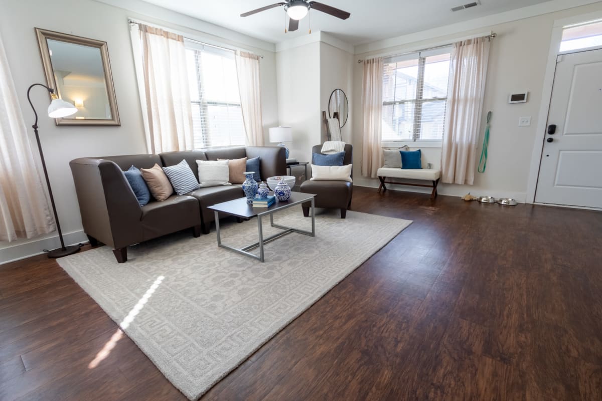 Spacious living room with hardwood-style flooring at The Waverly in Newark, Delaware