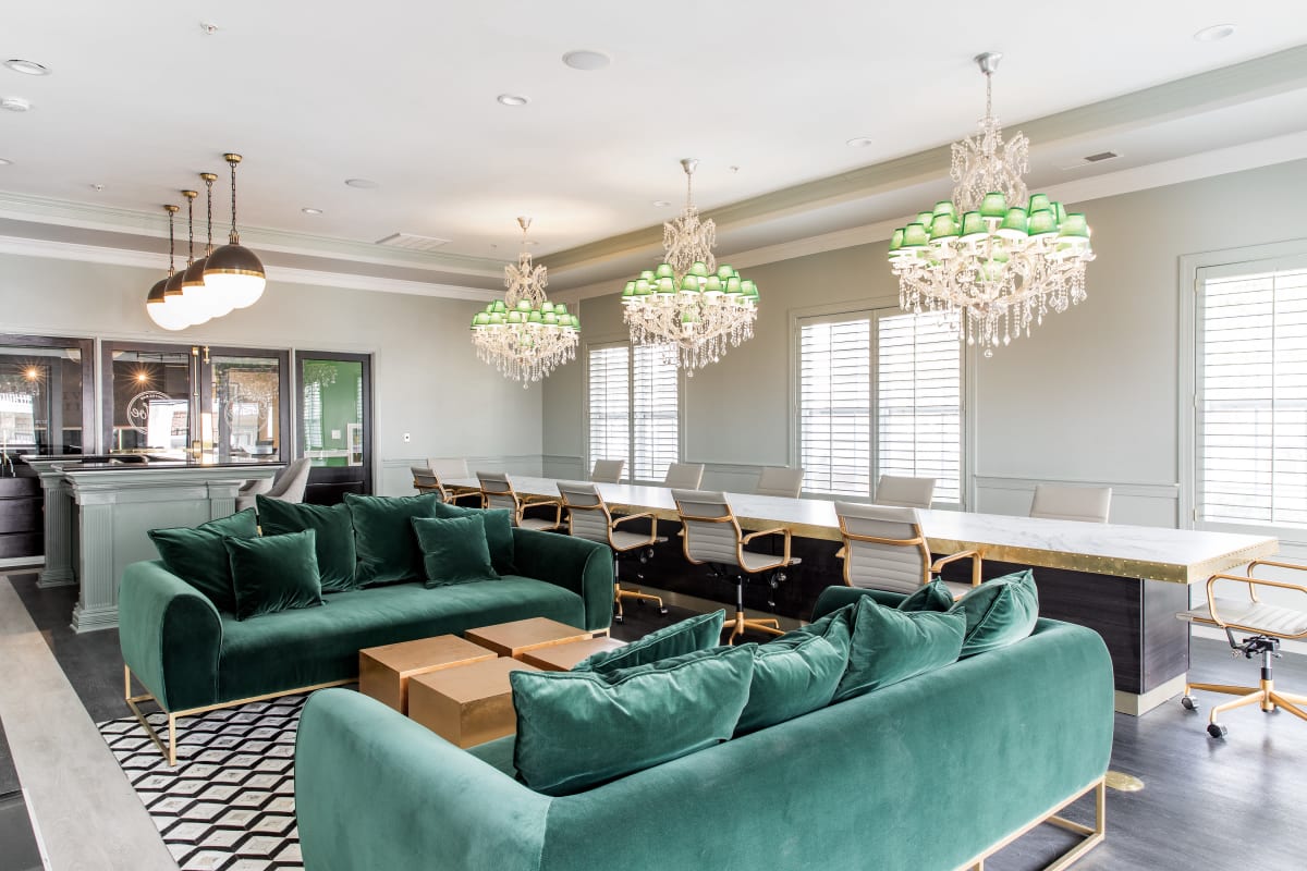 Velvet sofas and long table with plenty of seating for a group study session or hangout at University Village in Greensboro, North Carolina