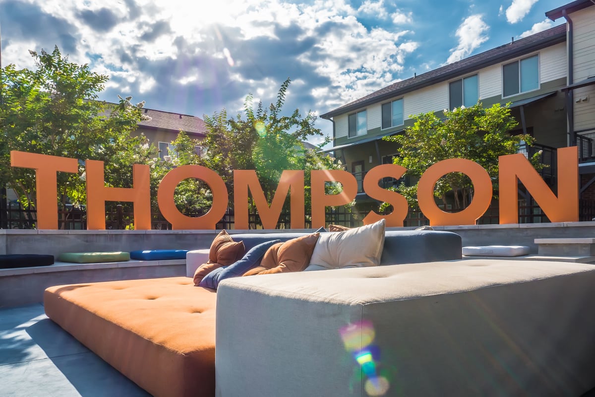 Sunny outdoor lounge space at The Thompson in San Marcos, Texas