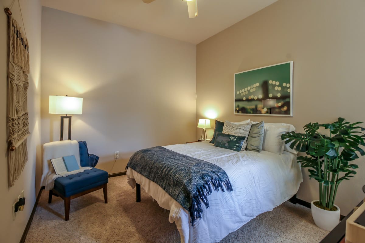 Spacious bedroom with a ceiling fan at Crimson in Tuscaloosa, Alabama