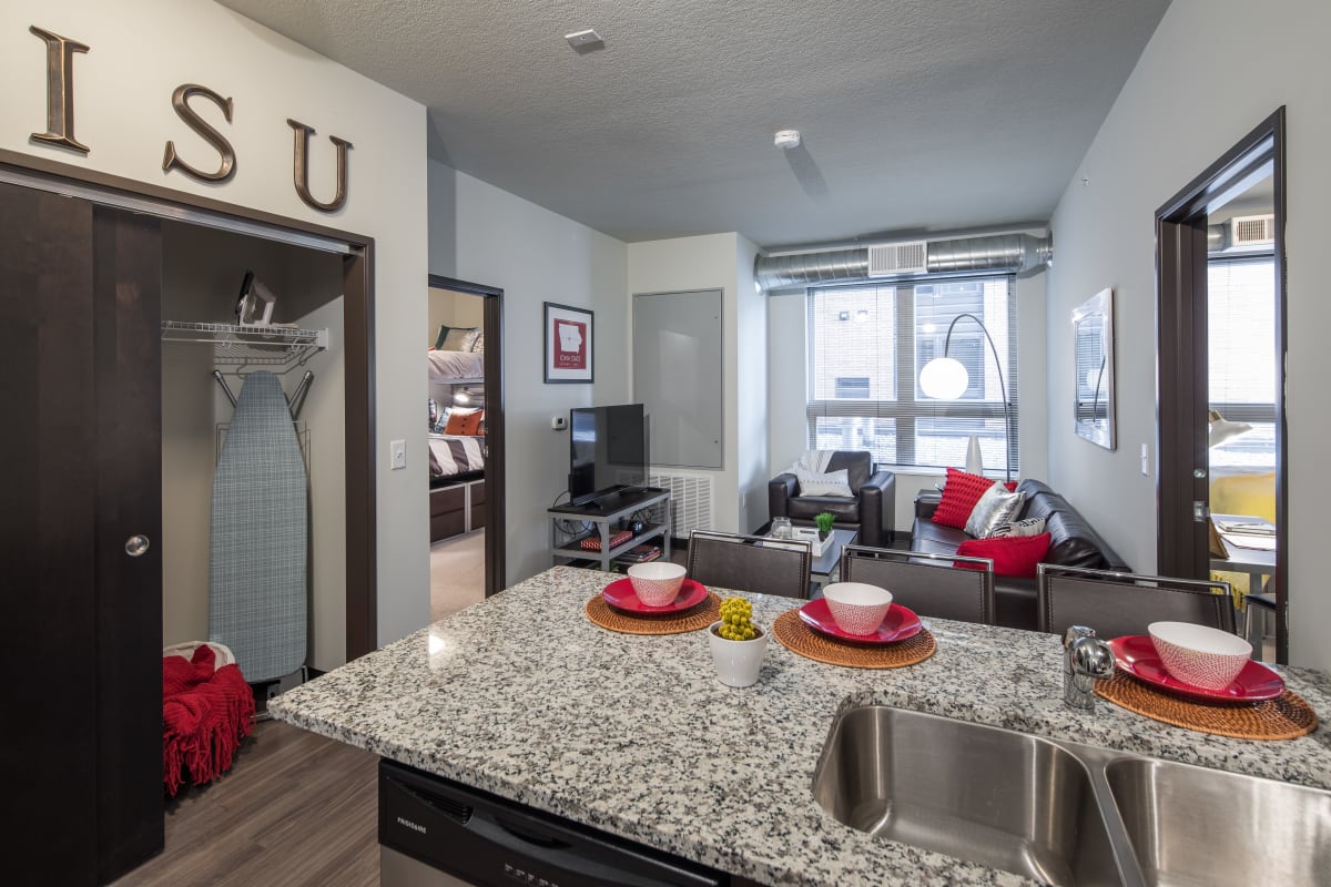 Kitchen with granite countertops and ample storage space at The Foundry in Ames, Iowa