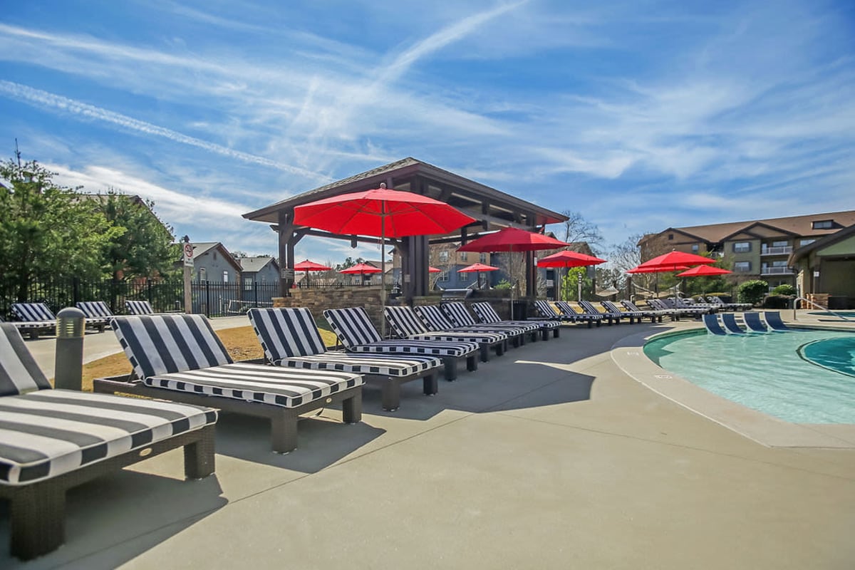 Luxury lounge chairs by the resort-style pool at West 22 in Kennesaw, Georgia