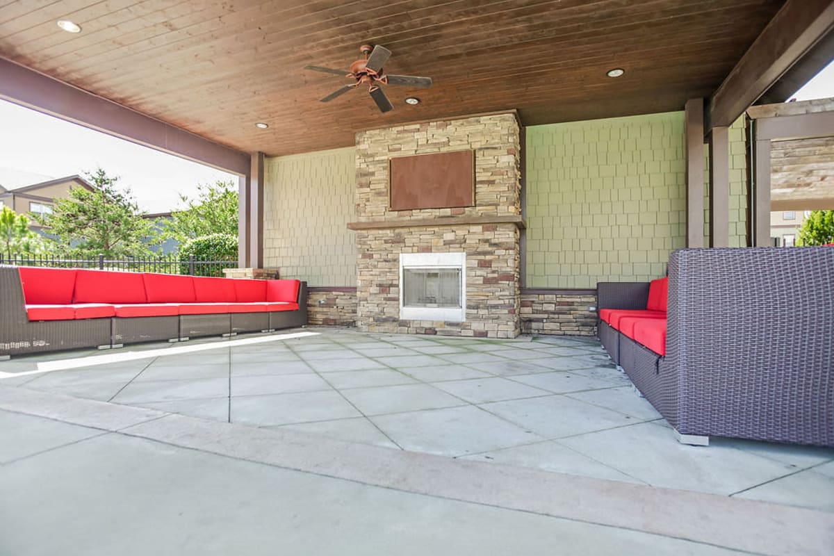 Outdoor lounge space with a fireplace at West 22 in Kennesaw, Georgia