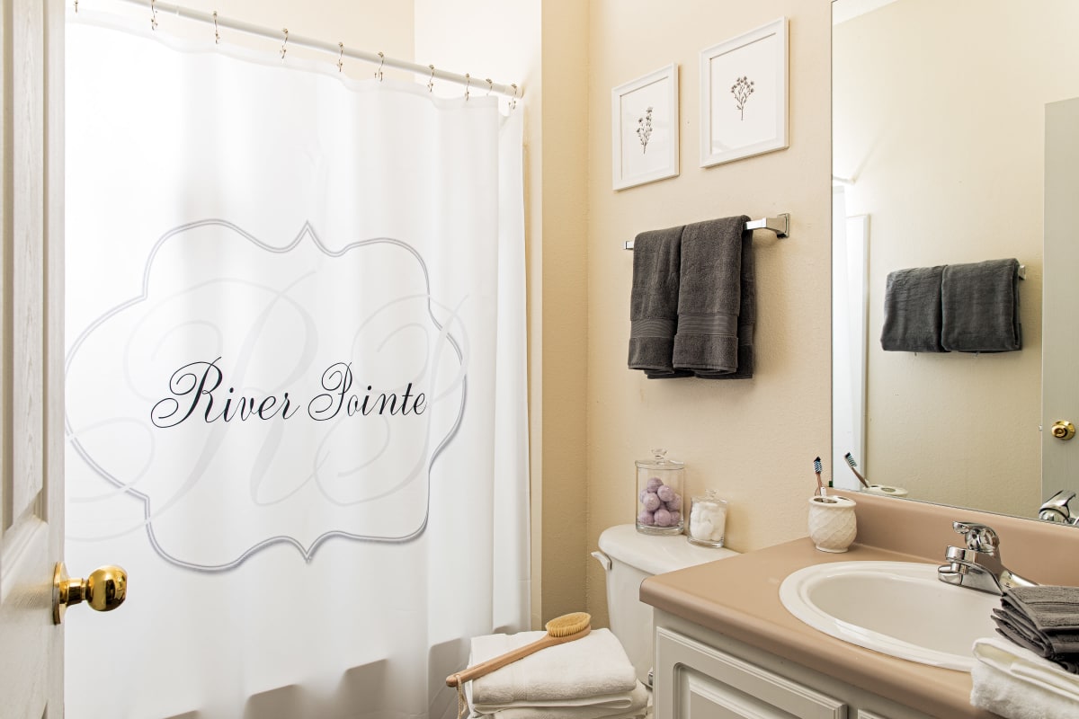Bathroom with a tub/shower combination at River Pointe in Carrollton, Georgia