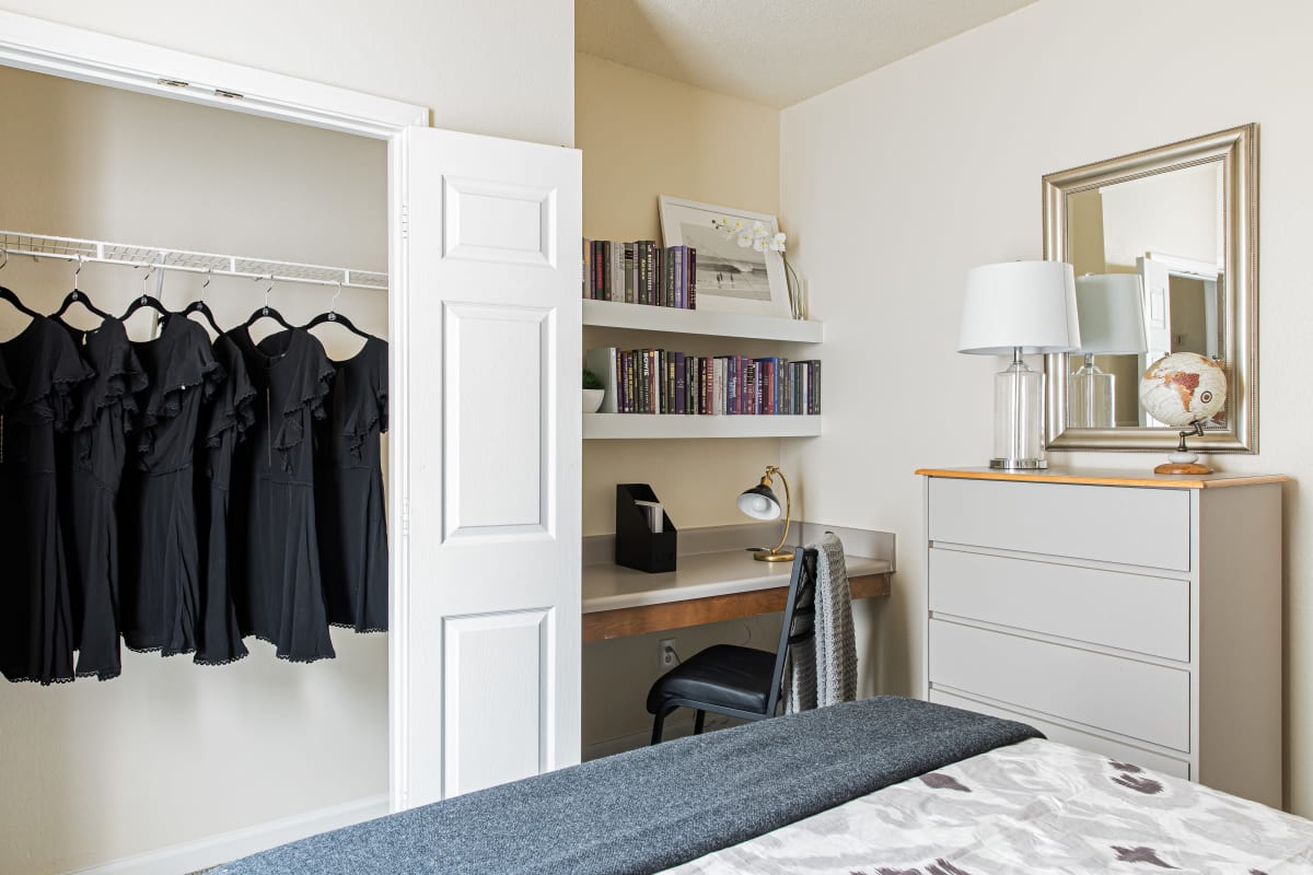 Spacious closet and built-in desk in a bedroom at River Pointe in Carrollton, Georgia
