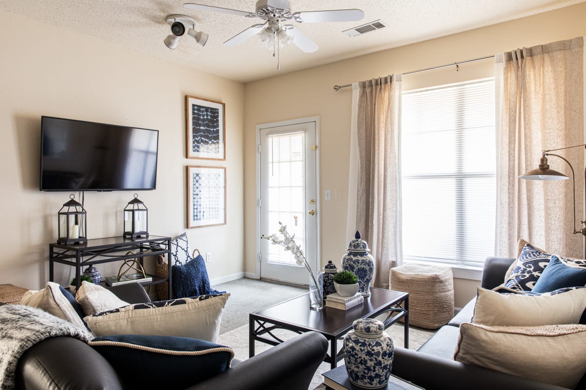 Spacious living room of a model student apartment at River Pointe in Carrollton, Georgia