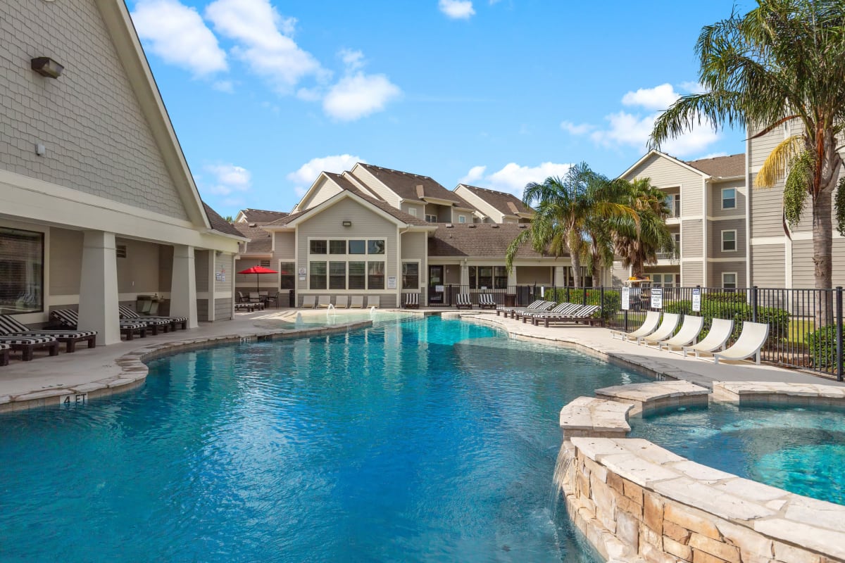 Resort style pool and clubhouse area at Campus Quarters in Corpus Christi, Texas