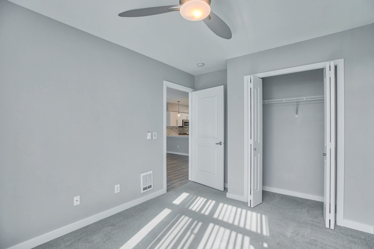 New plush carpeting and a ceiling fan in a recently remodeled apartment at 700 Broadway in Seattle, Washington